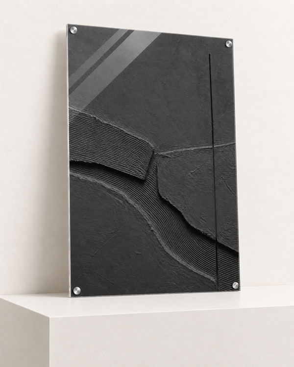 Charcoal Relief | Acrylic Print | 70x100 cm; 4mm acrylic, four silver corner caps, resting on raised light platform — angle